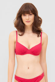 Frontalbild von Bikini-Oberteil im pinken Mini-Tupfen-Druck recyceltes Polyamid/Elasthan