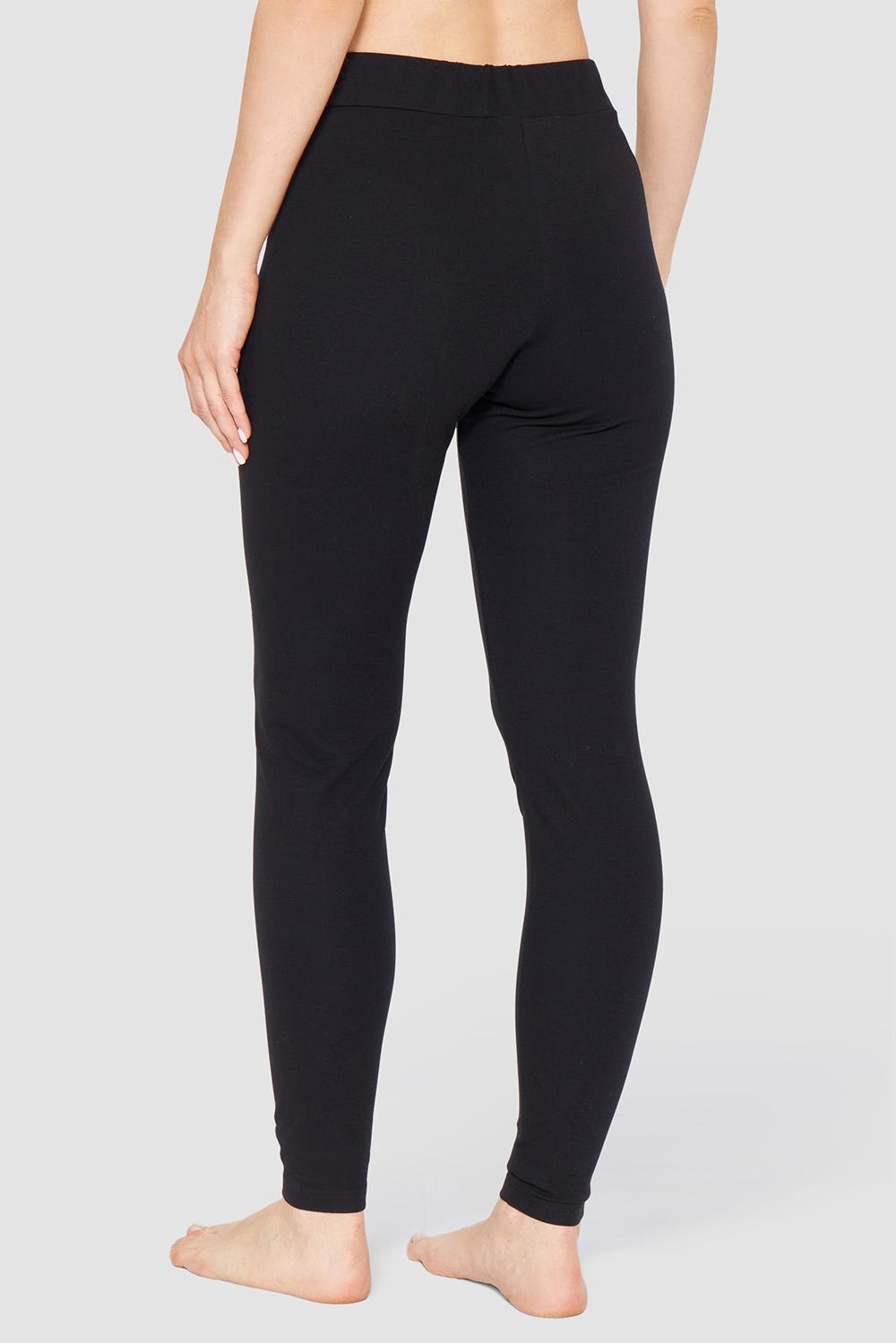 Rückansicht von Basic Leggings in Schwarz Logodetail Materialmix