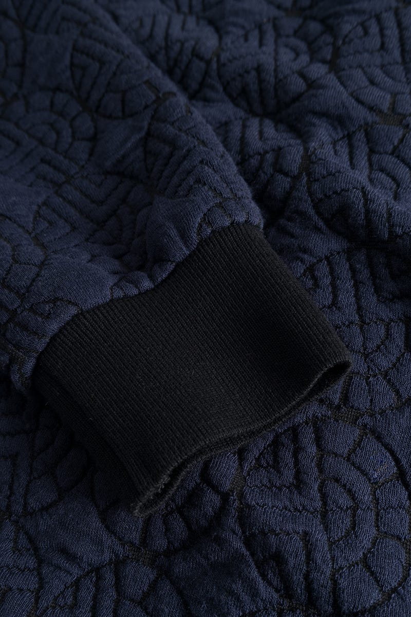 Detailbild 2 von Hausanzug aus Strickware mit Logo-Steppjacke Materialmix